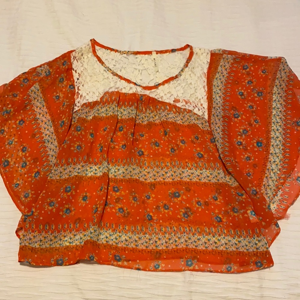 Francesca’s orange flowy sheer top